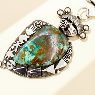 Turquoise maiden pendant on a beige background