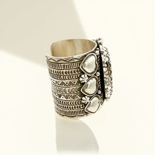 Silver cuff side on a beige background