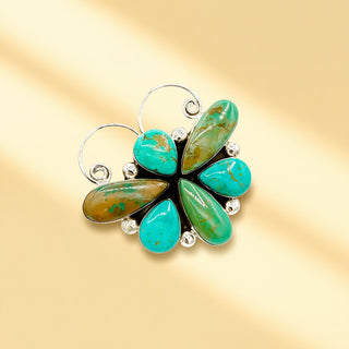 Jewelry with turquoise stones on a gold background