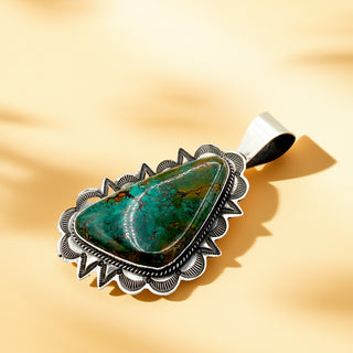 Turquoise pendant on a beige background