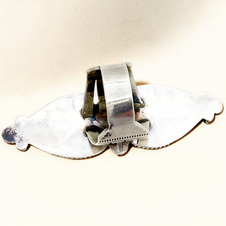 Silver ring shank on a beige background