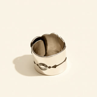 Silver ring on a beige background