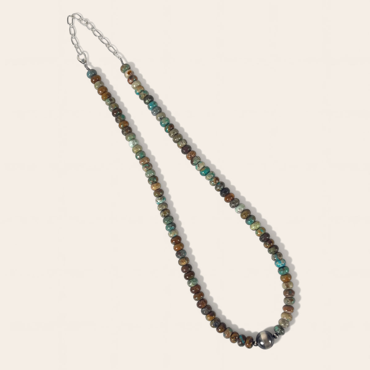 Beaded necklace with multicolored beads on a light background