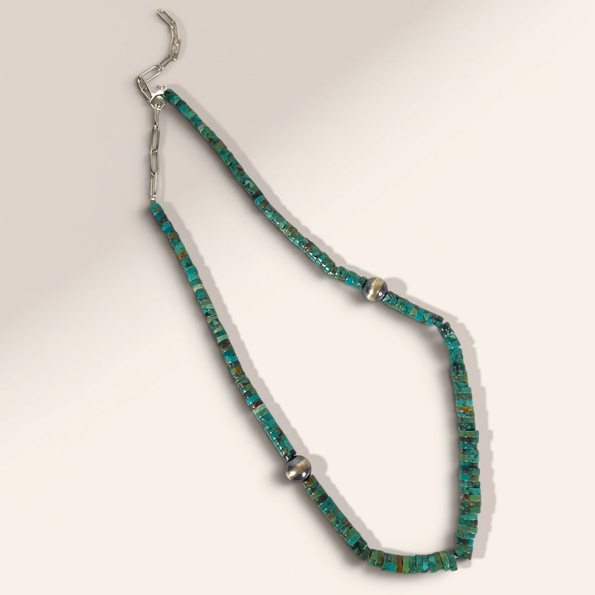 Necklace with turquoise beads on a white background