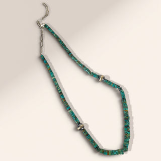 Necklace with turquoise beads on a white background