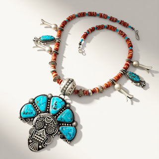 orange beaded necklace with turquoise pendant and turquoise stones on a beige background