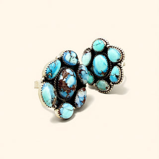 Rings with turquoise stones on a white background