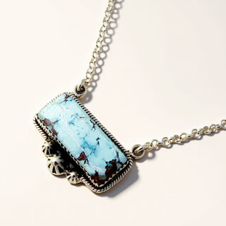 Turquoise necklace on a beige background
