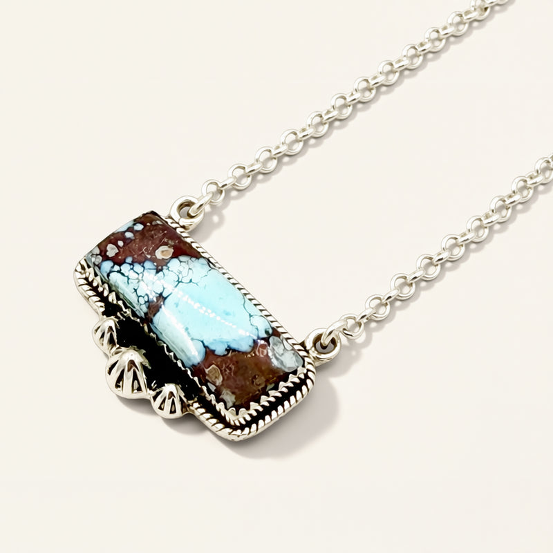 turquoise necklace on a beige background 