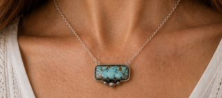 Turquoise necklace on a neck 