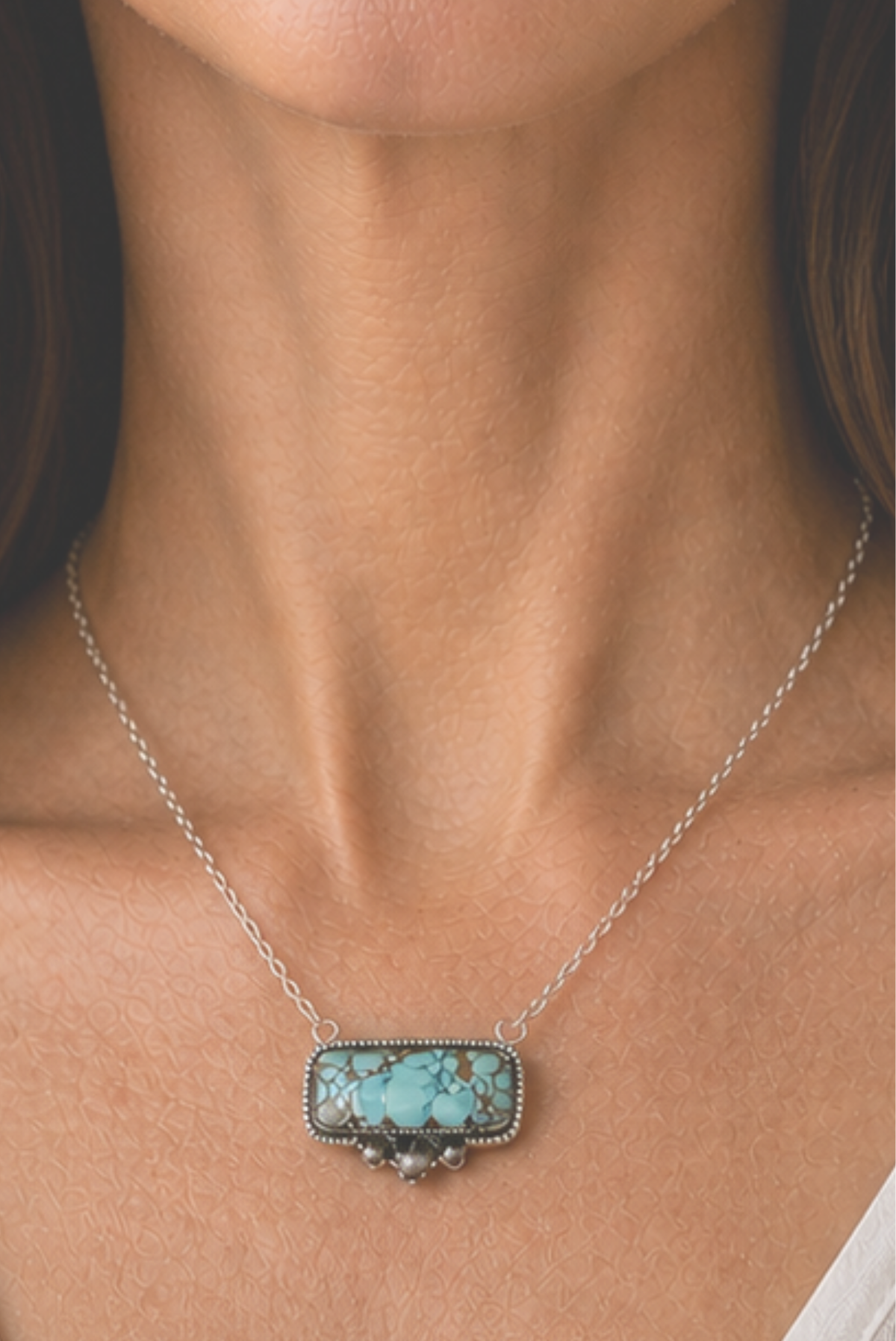 turquoise necklace on a neck
