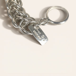 Silver chain keychain with a tag on a white background