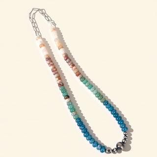 Necklace with multicolored beads on a white background