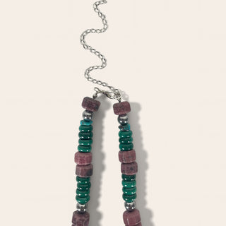 Necklace with multicolored beads on a light background