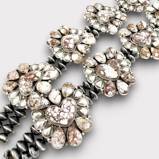 Close-up of decorative buttons with intricate designs on a light gray background