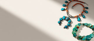Turquoise necklace and bracelet on a beige background