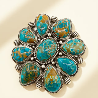 Turquoise stone ring with silver accents on a beige background
