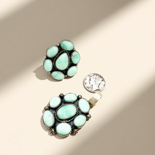 Turquoise stone jewelry on a beige background