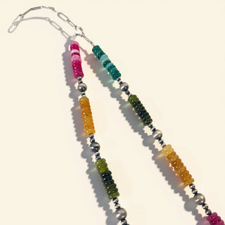 Colorful beaded necklace with silver clasps on a white background
