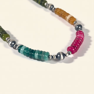 Necklace with multicolored beads on a light background