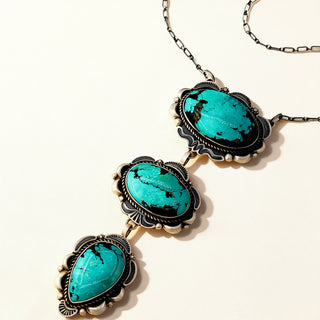 Necklace with turquoise stones on a white background
