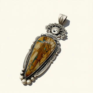 Silver pendant with a large stone and pearl accents on a white background