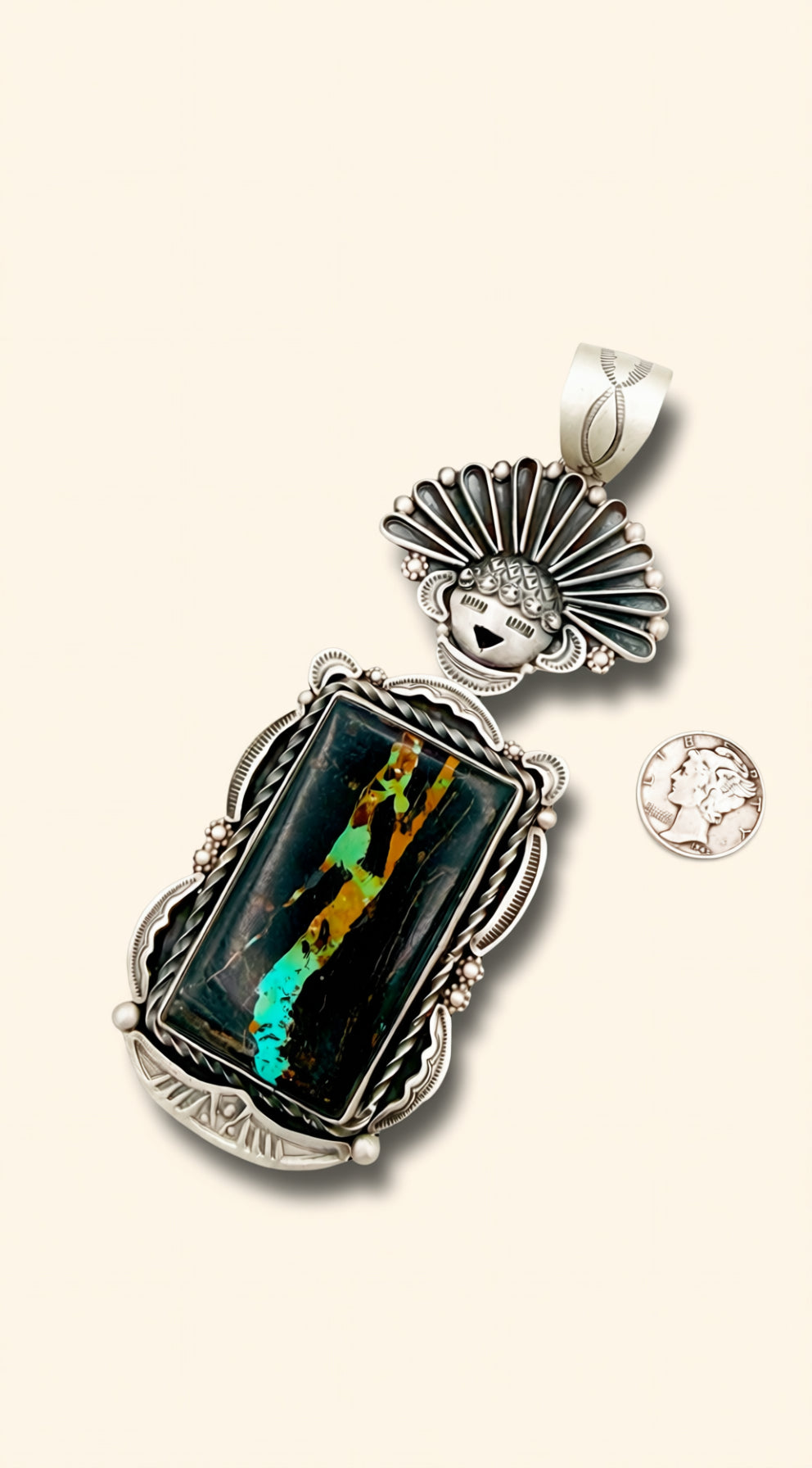 Silver pendant with a colorful stone on a white background