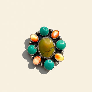 Jewelry with multicolored stones on a beige background