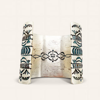 Decorative ceramic piece with tribal patterns on a white background