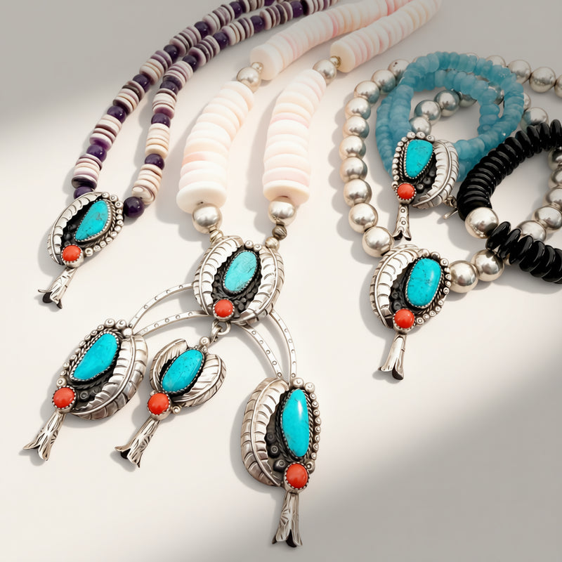 Necklaces with turquoise stones and coral beads on a light background