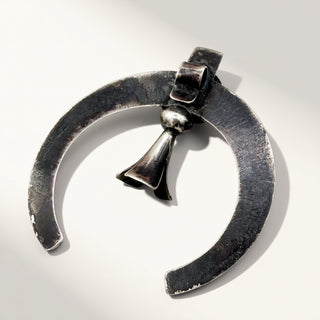 Silver  pendant on a white background