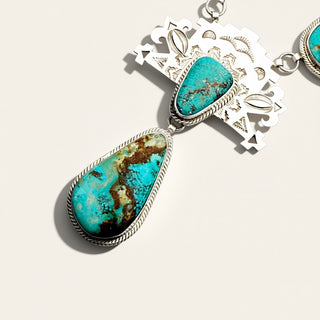 Turquoise stone jewelry on a beige background