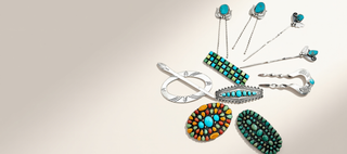 A collection of silver-toned jewelry pieces with turquoise and multicolor stone accents, arranged on a plain beige background.