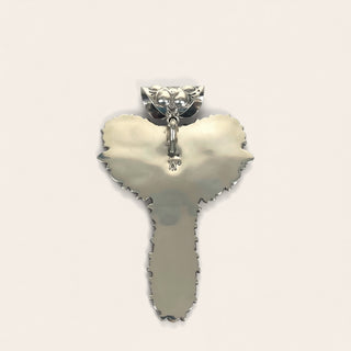 Pendant shaped like a key on a white background