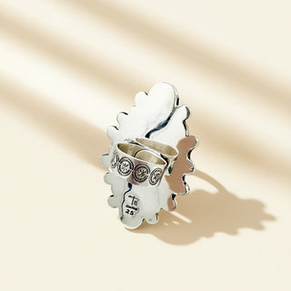 Silver ring shank on a beige background