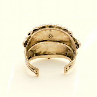 Silver cuff on a beige background