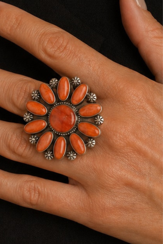 orange ring on a hand 
