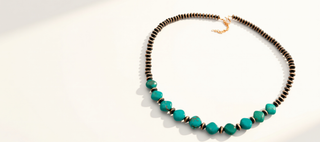Necklace with turquoise beads on a white background